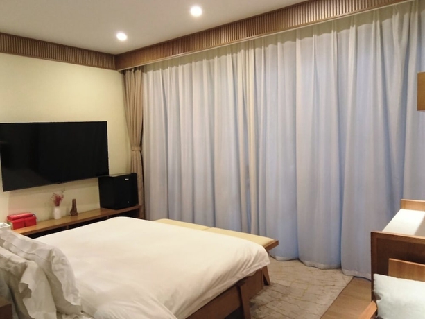 Imagen de la habitación del Hotel Silk Road-Fu Tea Town Boutique Homestay. Foto 8
