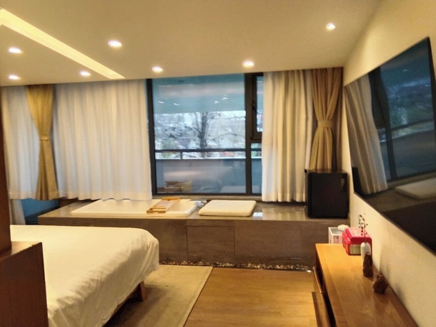 Imagen de la habitación del Hotel Silk Road-Fu Tea Town Boutique Homestay. Foto 9