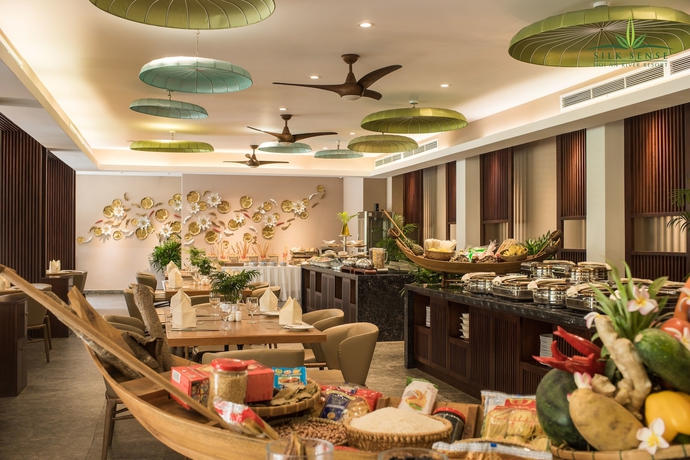 Imagen del bar/restaurante del Hotel Silk Sense Hoi An River Resort. Foto 5