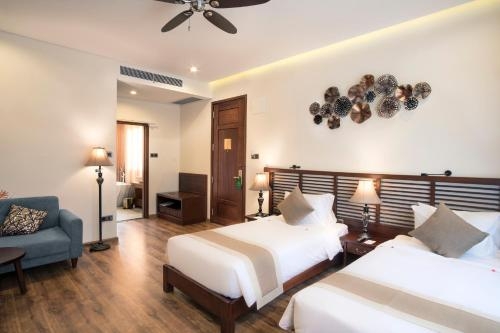 Imagen de la habitación del Hotel Silk Sense Hoi An River Resort, Hoi An. Foto 8