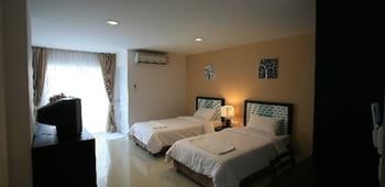 Imagen de la habitación del Hotel Similan Mansion. Foto 5