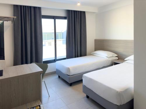 Imagen de la habitación del Hotel Simon Aprilia. Foto 18