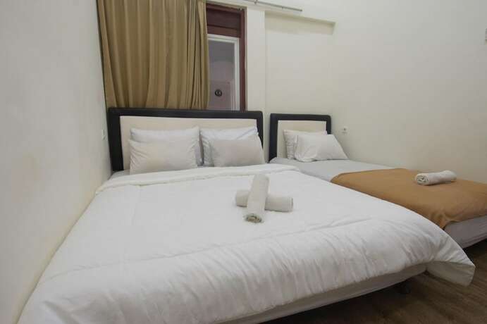 Imagen de la habitación del Hotel Simpang 7 Residence. Foto 11