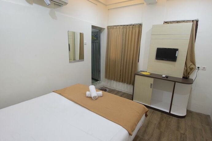 Imagen de la habitación del Hotel Simpang 7 Residence. Foto 12