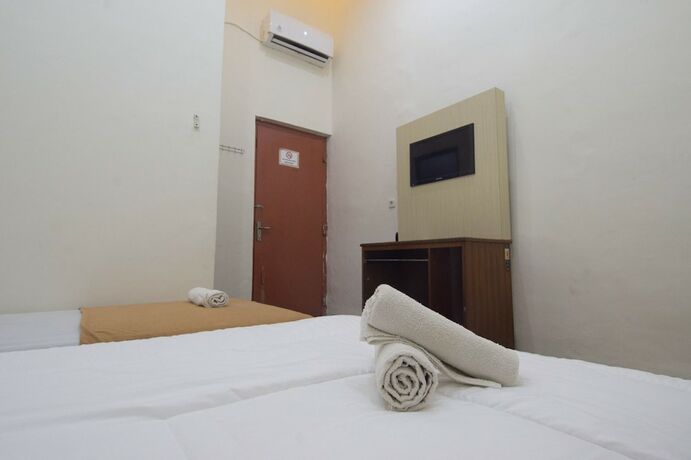 Imagen de la habitación del Hotel Simpang 7 Residence. Foto 16