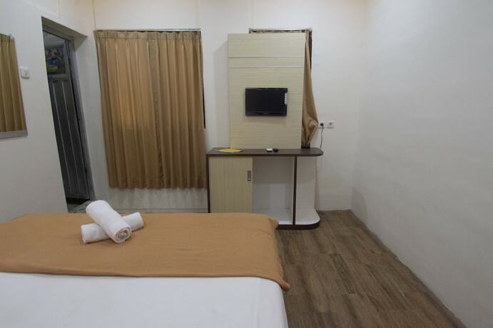 Imagen de la habitación del Hotel Simpang 7 Residence. Foto 17