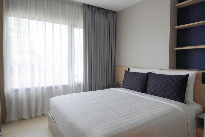 Imagen de la habitación del Hotel Sindhorn Midtown. Foto 2