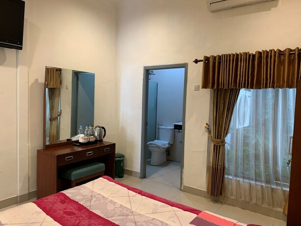 Imagen de la habitación del Hotel Sinergi Tretes. Foto 20