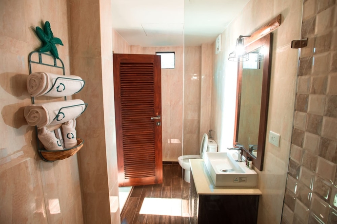 Imagen de la habitación del Hotel Sinq Beach Morjim. Foto 16