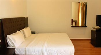 Imagen de la habitación del Hotel Sinq Beach Resort. Foto 6