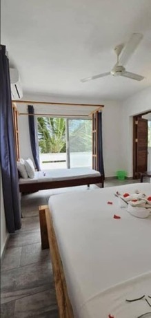 Imagen de la habitación del Hotel Sipano Beach Lodge. Foto 15