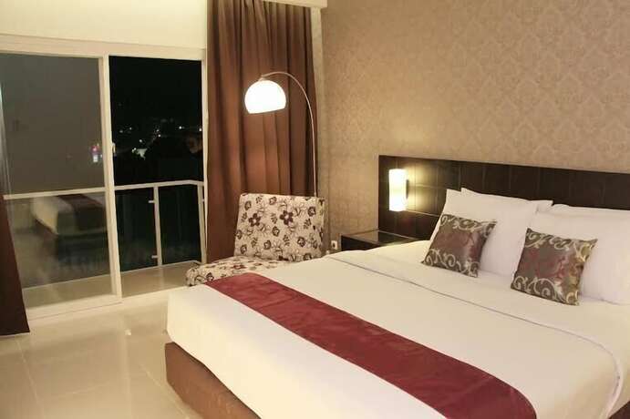 Imagen de la habitación del Hotel Sisingamangaraja Guest House Semarang. Foto 18