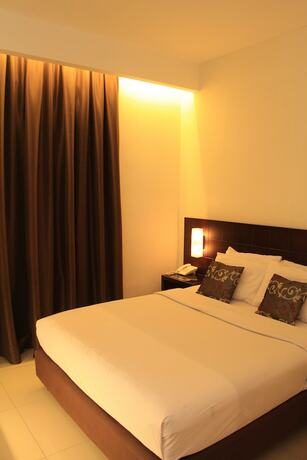 Imagen de la habitación del Hotel Sisingamangaraja Guest House Semarang. Foto 19