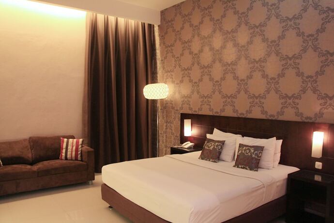 Imagen de la habitación del Hotel Sisingamangaraja Guest House Semarang. Foto 24