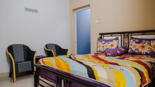 Imagen de la habitación del Hotel Sitiinggil Guest House Syariah. Foto 19