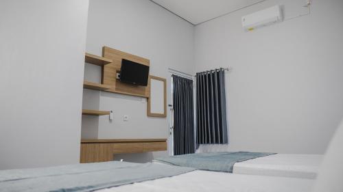 Imagen de la habitación del Hotel Sitiinggil Guest House Syariah. Foto 20