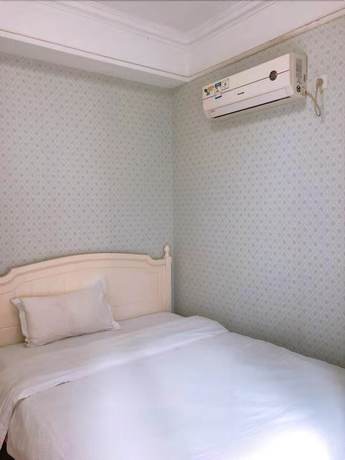 Imagen de la habitación del Hotel Sixiangjia Apartment. Foto 13