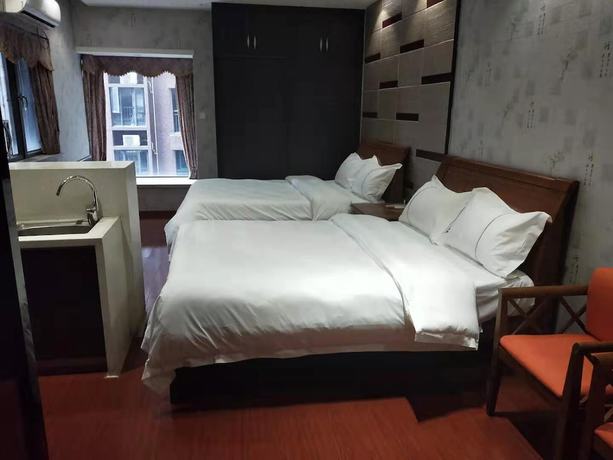Imagen de la habitación del Hotel Sixiangjia Apartment. Foto 15