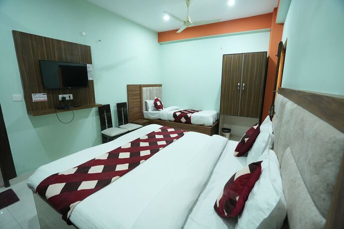 Imagen de la habitación del Hotel Sjh Venkatesh. Foto 13