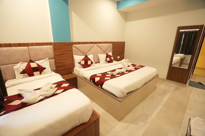Imagen de la habitación del Hotel Sjh Venkatesh. Foto 18