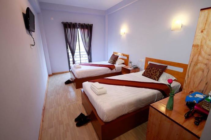 Imagen de la habitación del Hotel Sky Motel Kalaw. Foto 7