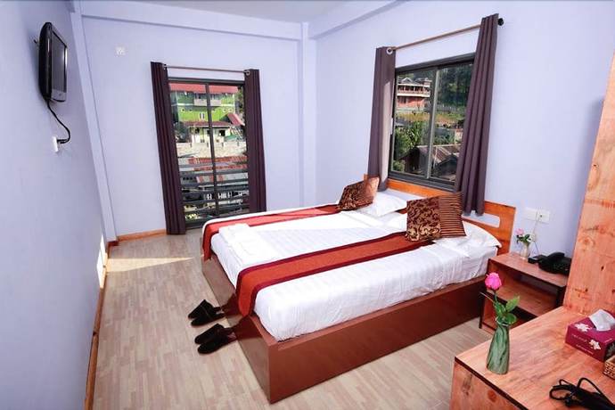 Imagen de la habitación del Hotel Sky Motel Kalaw. Foto 9