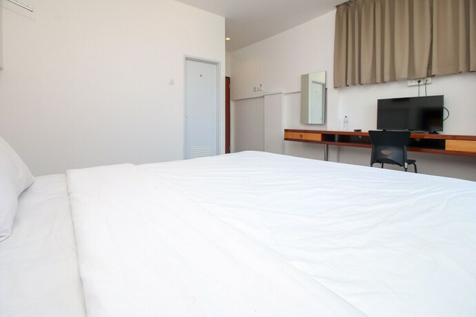 Imagen de la habitación del Hotel Sky Residence Simpang Lima 1 Semarang. Foto 19