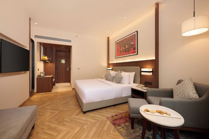 Imagen de la habitación del Hotel Skywings Sarovar Portico Mathura. Foto 12
