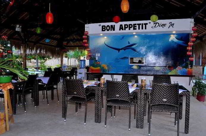 Imagen del bar/restaurante del Hotel Slam's Garden Dive Resort. Foto 7