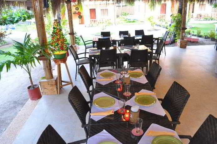 Imagen del bar/restaurante del Hotel Slam's Garden Dive Resort. Foto 8