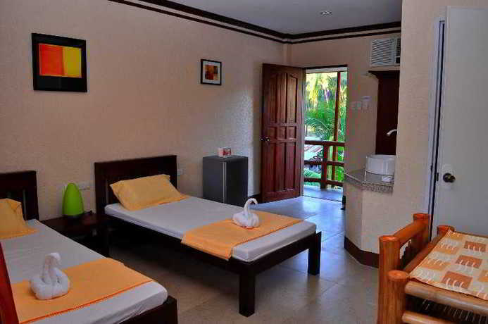 Imagen de la habitación del Hotel Slam's Garden Dive Resort. Foto 9