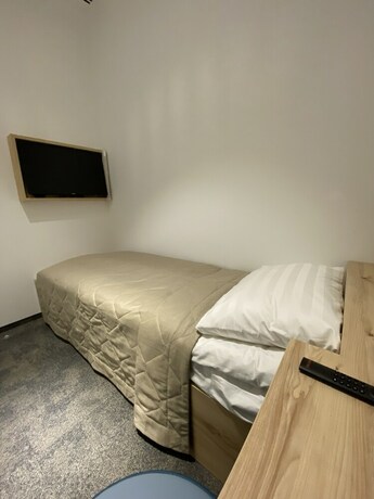 Imagen de la habitación del Hotel Sleep Lounge Terminal D - Hostel. Foto 17