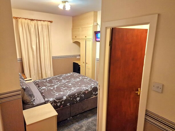 Imagen de la habitación del Hotel Sleep Well. Foto 15