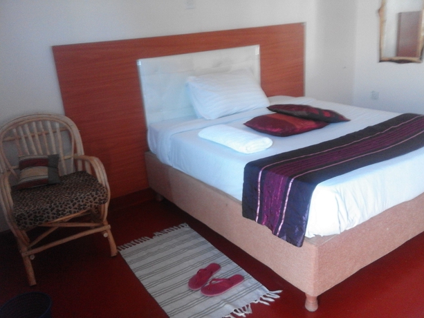 Imagen de la habitación del Hotel Sleepway Cottages. Foto 8