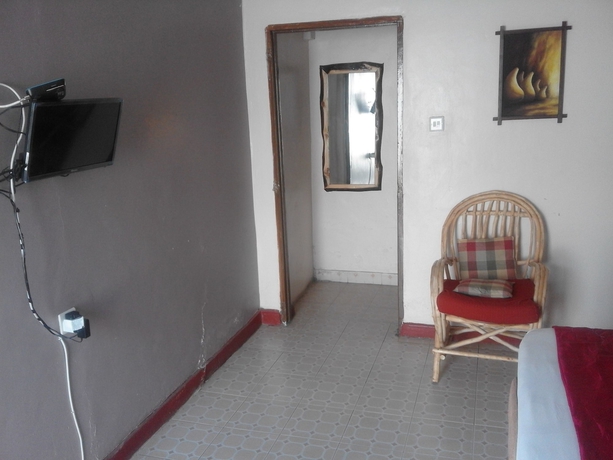 Imagen de la habitación del Hotel Sleepway Cottages. Foto 9