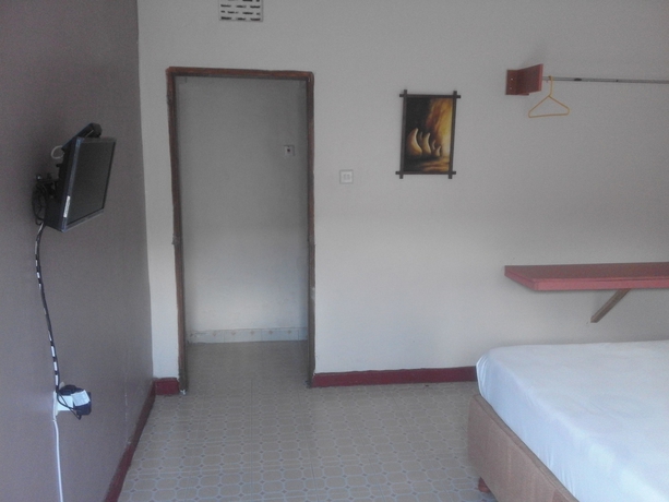 Imagen de la habitación del Hotel Sleepway Cottages. Foto 10