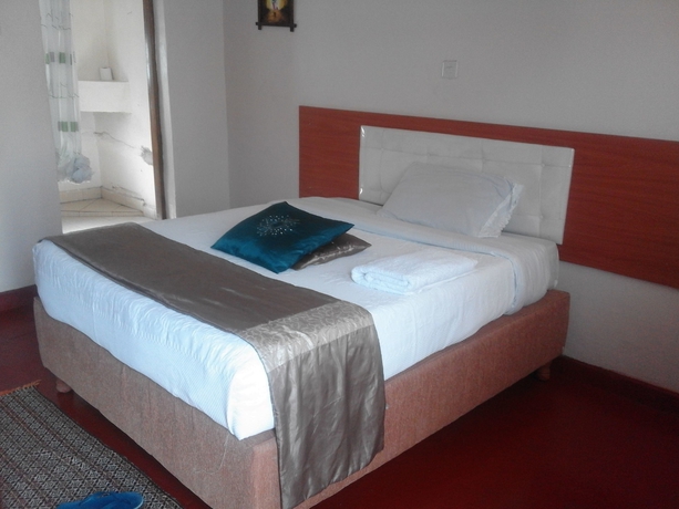 Imagen de la habitación del Hotel Sleepway Cottages. Foto 11