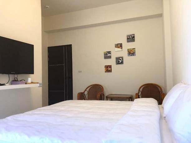 Imagen de la habitación del Hotel Small Cat Hotel. Foto 15