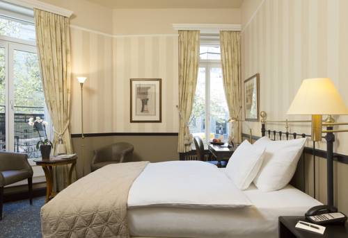 Imagen de la habitación del Hotel Small Luxury Ambassador Zürich. Foto 12