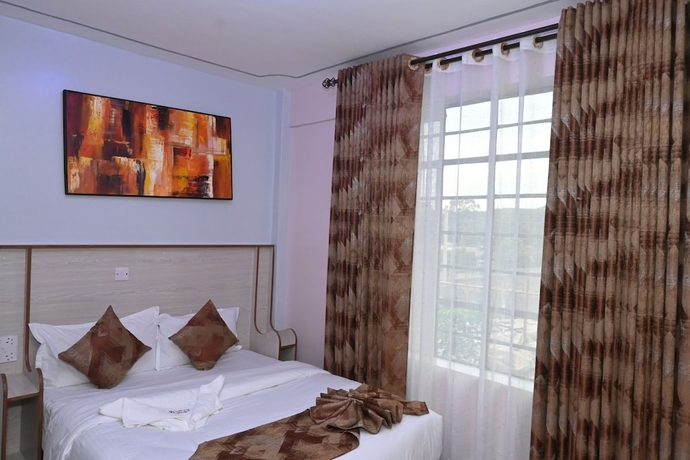 Imagen de la habitación del Hotel Smartstay Mungai Heights. Foto 9