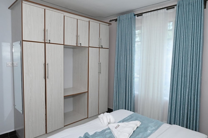 Imagen de la habitación del Hotel Smartstay Mungai Heights. Foto 13