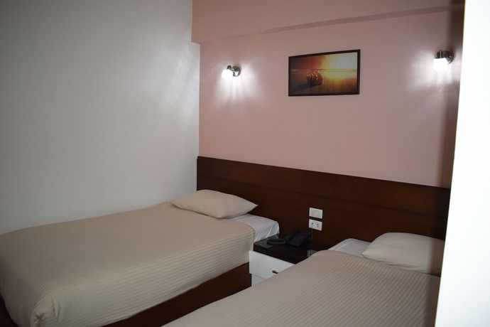 Imagen de la habitación del Hotel Smg Travel. Foto 7