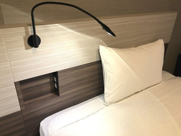Imagen de la habitación del Hotel Smile Aomori. Foto 16
