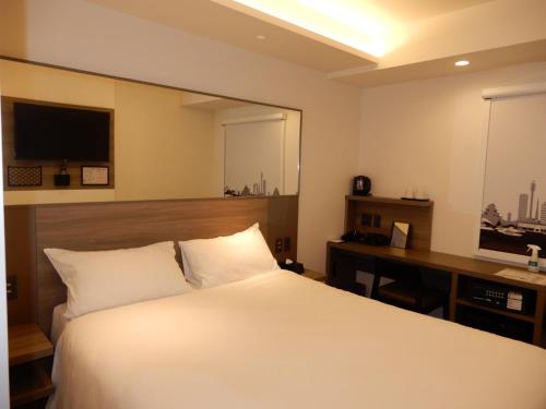 Imagen de la habitación del Hotel Smile Hiroshima. Foto 16