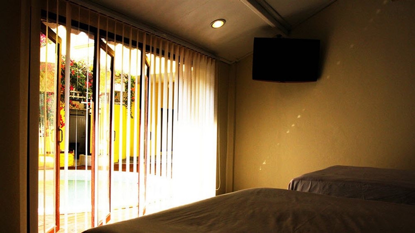 Imagen de la habitación del Hotel Smile House Guesthouse. Foto 1