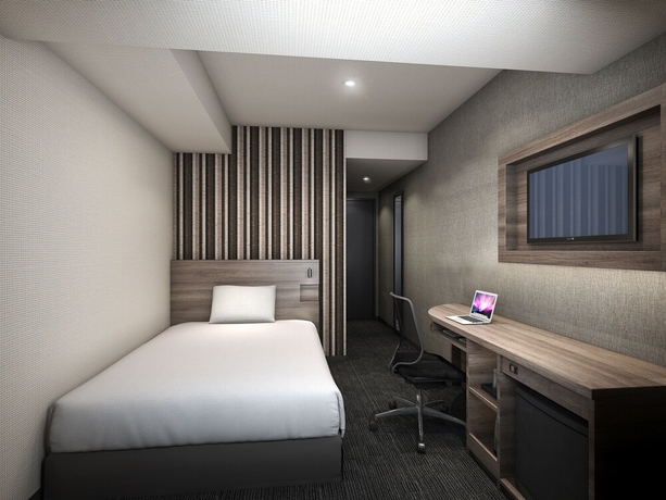 Imagen de la habitación del Hotel Smile Shinosaka. Foto 7