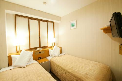 Imagen de la habitación del Hotel Smile Shizuoka. Foto 2