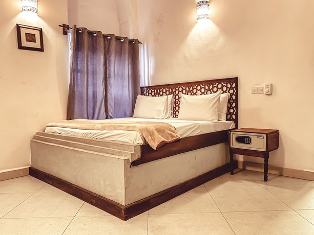 Imagen de la habitación del Hotel Smiles Stone Town. Foto 12