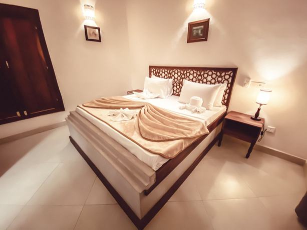 Imagen de la habitación del Hotel Smiles Stone Town. Foto 13