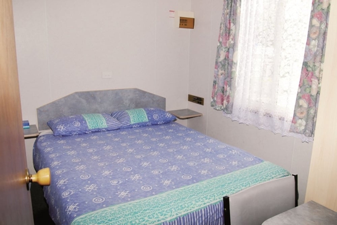 Imagen de la habitación del Hotel Smugglers Cove Holiday Village. Foto 9